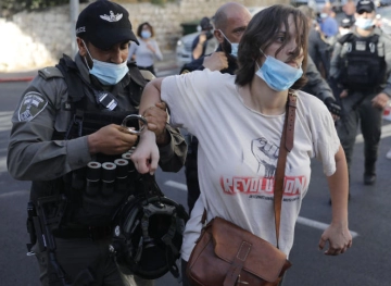 The occupation police suppress a march against the killing of Iyad al-Hallaq in Jerusalem