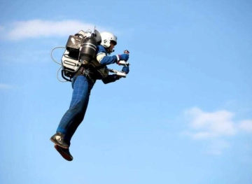 A man is flying in the air using a jetpack in Los Angeles