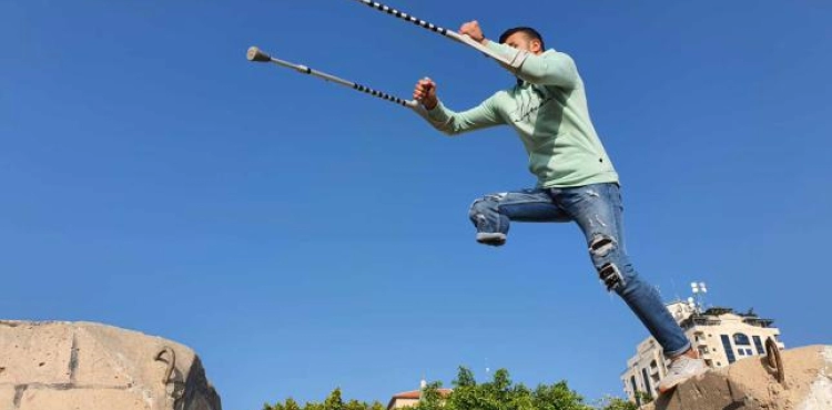 A boy from Gaza shot by the occupation forces defies disability with parkour sport
