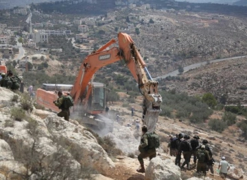Injuries in clashes with the occupation forces while confronting the building of a settlement road in Kafr Naama