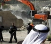 The occupation forces a citizen to demolish a livestock pens east of Bethlehem