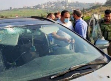 Settlers wear tires and break windows, south of Bethlehem