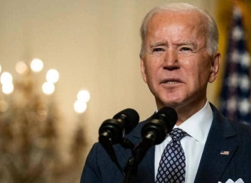 Biden signs an executive order that facilitates the voting process on the anniversary of the crackdown on a civil rights march