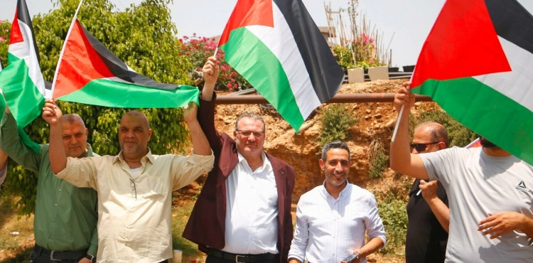 The start of a march to raise the Palestinian flags in Qalqilya
