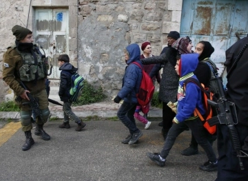 The occupation forces detain students and teachers of a school in Hebron