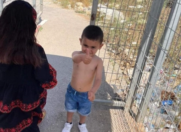 The occupation forces a child to take off his clothes in Jenin