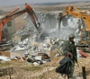The occupation demolishes a commercial facility and assaults citizens in Jenin