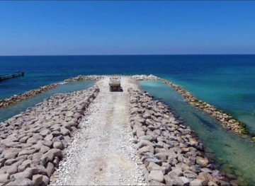The occupation continues to build a maritime barrier separating the Gaza Strip