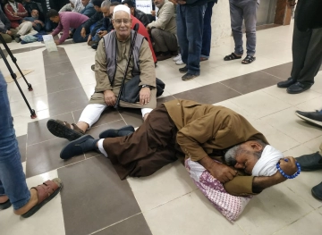 Victims of the 2014 aggression they sit inside UNRWA headquarters in Gaza
