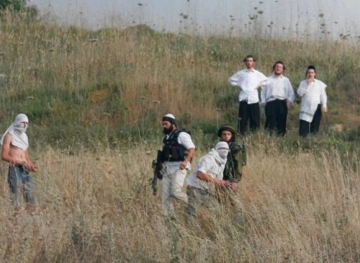Clashes during an attack by settlers in Qasra